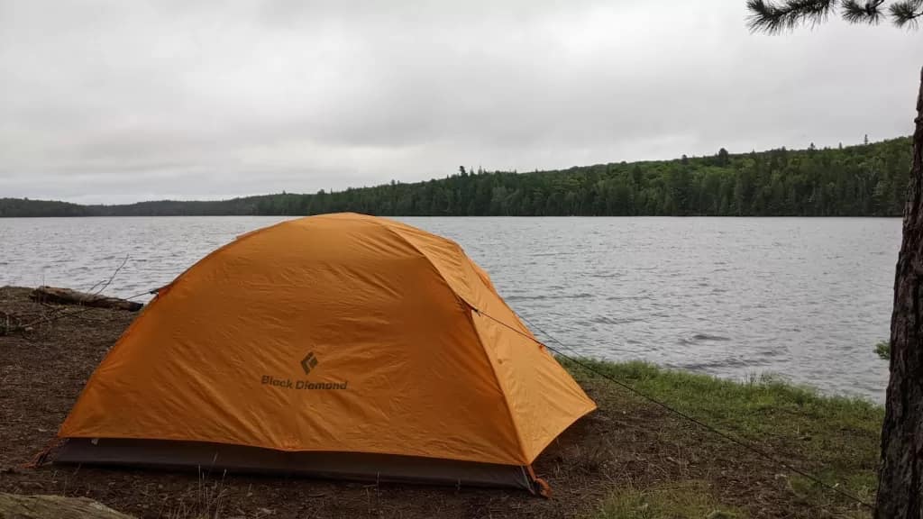 picture of a tent on a lake in the backcountry of Algonquin Provincial Park taken by Tim Good of the Super Good Camping Podcast