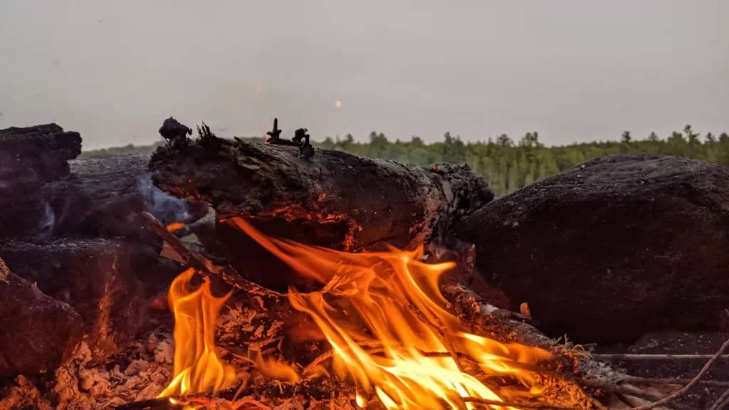 picture of a campfire in the backcountry  while camping in Ontario