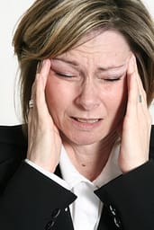 woman with headaches and migraines premenstrual menopause