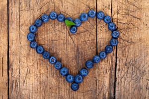 heart made of blueberries to signify natural fertility treatment 