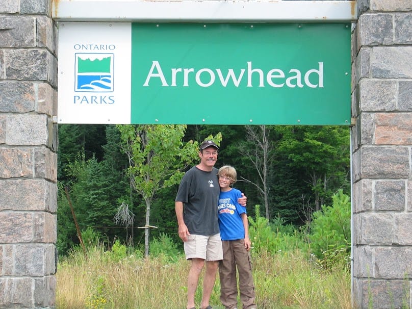 tim and thomas at the entrance to Arrowhead Provincial Park to go camping